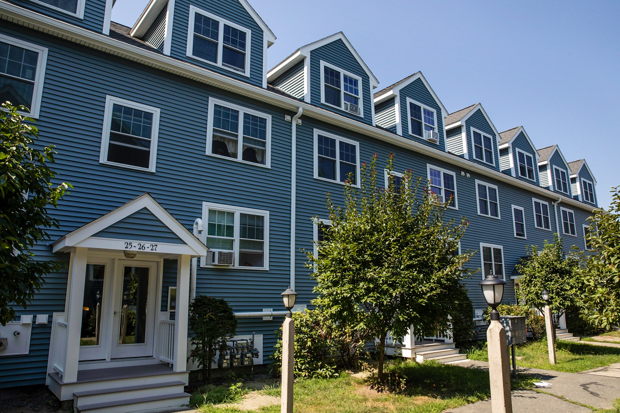 Condominium building with new-construction windows integrated into the exterior wall system